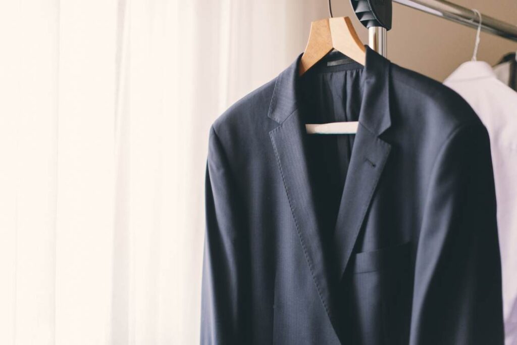 a suit hangs on a hanger