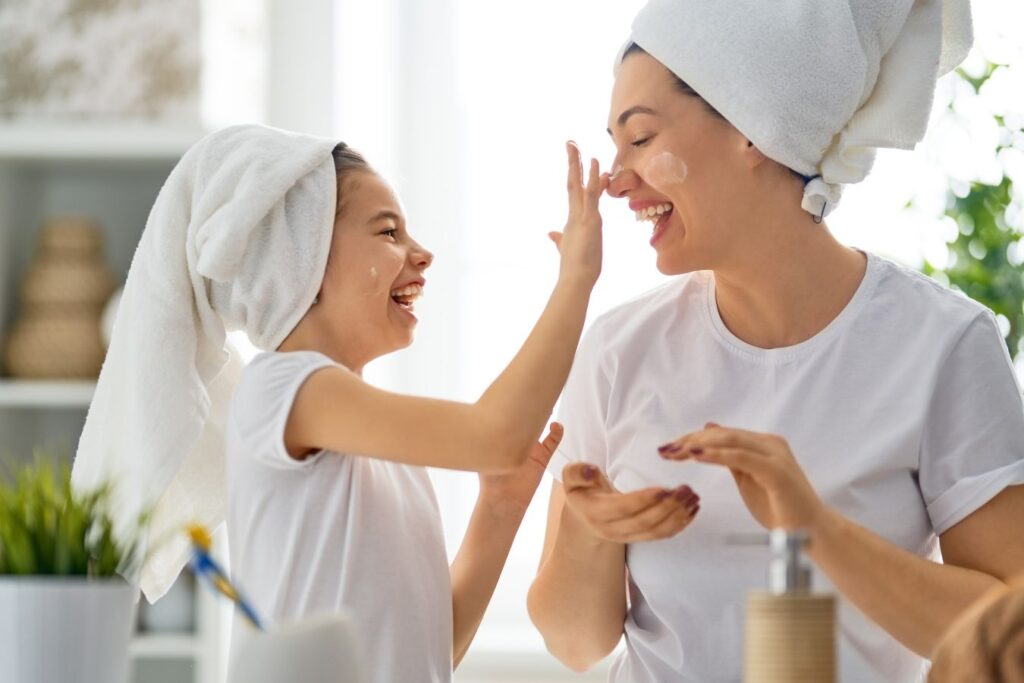 a mom and her daughter having a spa day at home