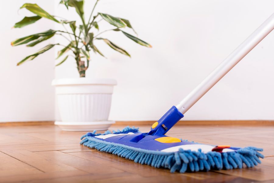 mopping house for holiday cleaning