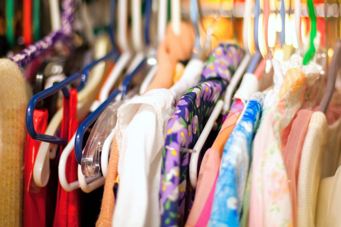 thrift store rack of dresses