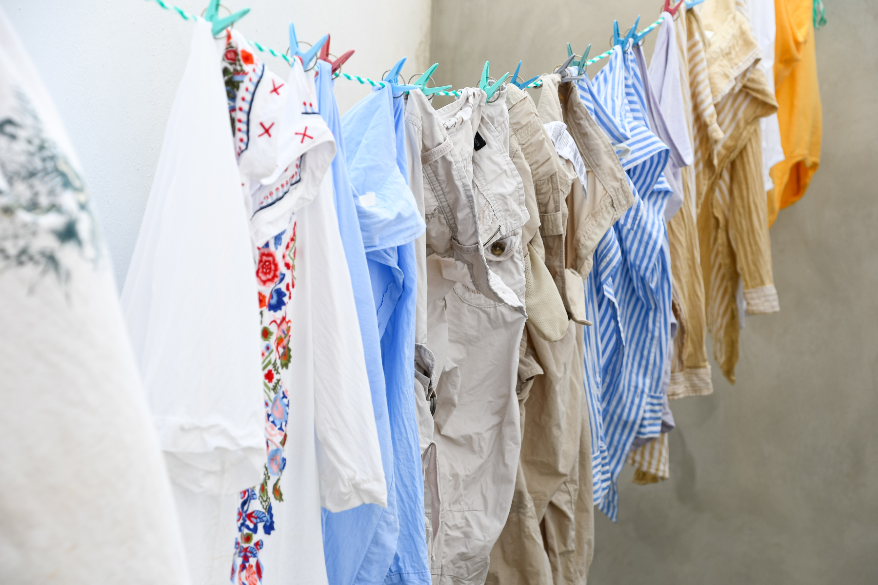 water damaged clothes on a clothesline drying