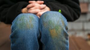 jeans with grass stains needing removal