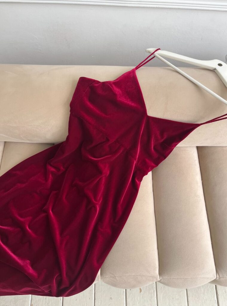 red velvet dress on a hanger