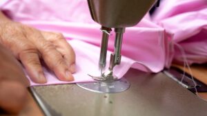 keans tailor altering a pink dress