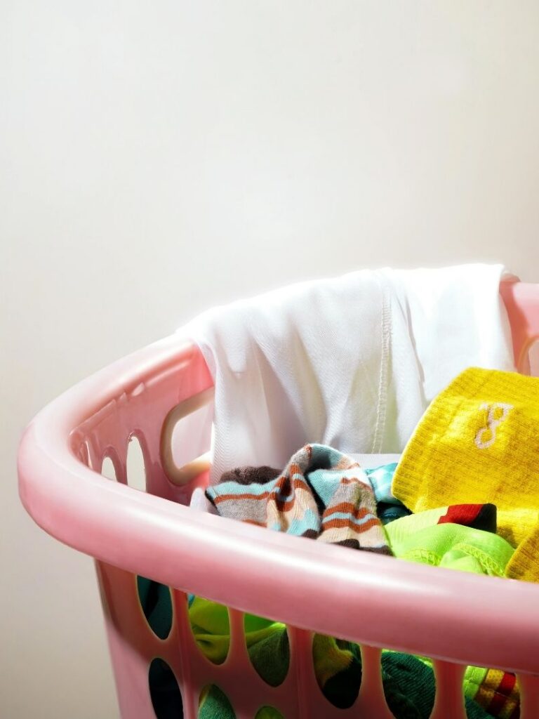 laundry basket of baby clothes