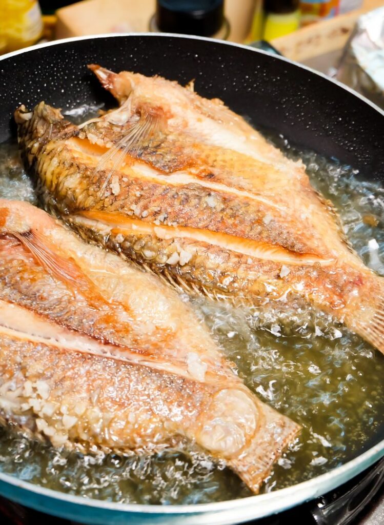 frying fish in a pan