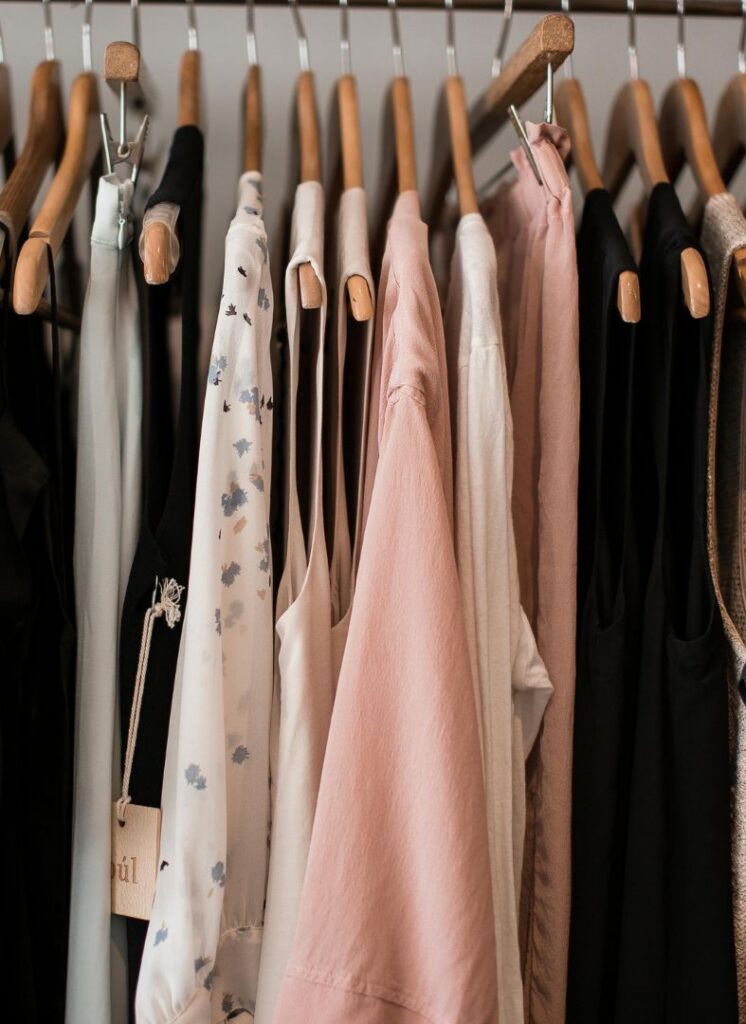 clothes hanging in a closet with a mildew odor