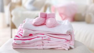 freshly washed and folded baby clothes