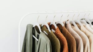 rack of dry cleaned unshrunk clothes