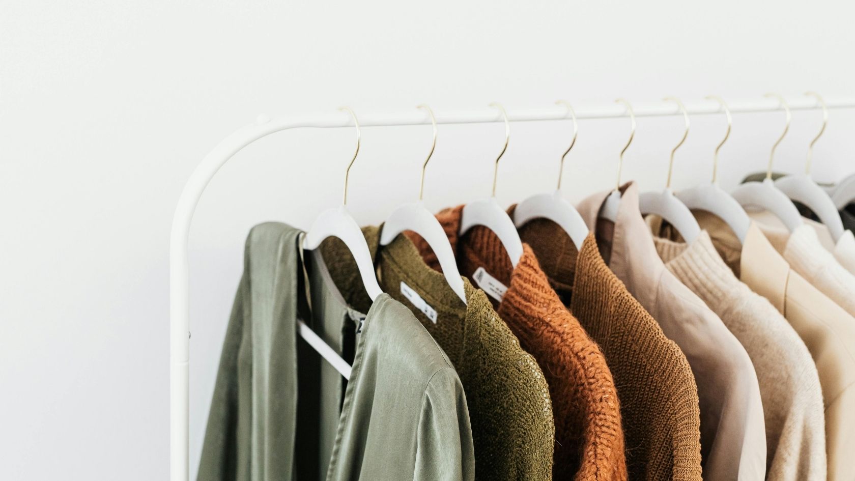 rack of dry cleaned unshrunk clothes