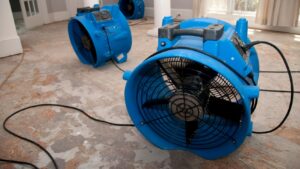 fans drying house during flood restoration process